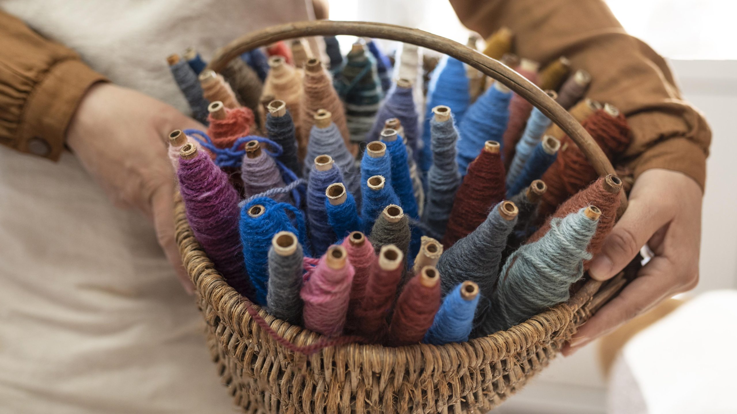 person working embroidery workshop